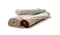 Rolled carpets on white background. Interior element Royalty Free Stock Photo
