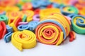 rolled coils of multicolored plasticine together