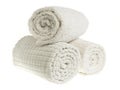 Rolled cream-colored spa towels