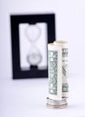 Rolled Dollar Bill On Coin Stack On Focus Royalty Free Stock Photo