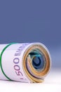 Rolled euro banknotes several thousand. Free space for your economic information Royalty Free Stock Photo