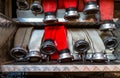 Rolled fire hoses, arranged in rows, in the glove compartment of the fire truck.