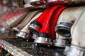 Rolled fire hoses, arranged in rows, in the glove compartment of the fire truck. Royalty Free Stock Photo