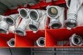 Rolled fire hoses, arranged in rows, in the glove compartment of the fire truck Royalty Free Stock Photo