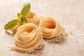 Rolled Flat Fresh Fettuccine Pasta on Table