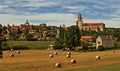 Hay bales and church in Martel, Lot, France