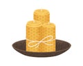 Rolled honeycomb candles in bowl. Natural beeswax pillars with honey scent. Handmade cosy home interior decoration tied