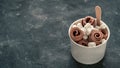 Rolled ice cream in cone cup on dark,copy space Royalty Free Stock Photo