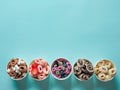 Rolled ice creams in cone cups on blue background Royalty Free Stock Photo
