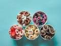 rolled ice creams in cone cups on blue background Royalty Free Stock Photo