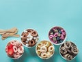 rolled ice creams in cone cups on blue background Royalty Free Stock Photo