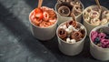 Rolled ice creams in cone cups on dark background Royalty Free Stock Photo