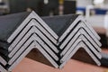Rolled metal, L-profil. Stack of angle steel in the factory Royalty Free Stock Photo