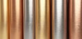 Rolled metallic sheets in gold, silver, and copper tones with brushed textures. Useful for luxury backgrounds, material design, Royalty Free Stock Photo