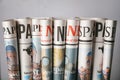 Rolled newspapers on grey background Royalty Free Stock Photo