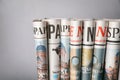 Rolled newspapers on grey background Royalty Free Stock Photo