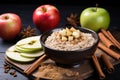 rolled oats with apple slices and cinnamon sticks