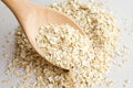 Rolled oats in big wooden spoon Royalty Free Stock Photo