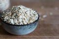 Rolled oats in ceramic bowl Royalty Free Stock Photo