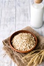 Rolled oats, oat flakes and bottle of milk Royalty Free Stock Photo