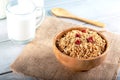 Rolled oats or oat flakes in bowl with wooden spoonsand bottle of milk Royalty Free Stock Photo