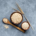 Rolled oats or oat flakes in wooden bowl, top view Royalty Free Stock Photo