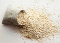 Rolled oats in burlap bag on wood table Royalty Free Stock Photo