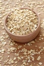 Rolled oats in a wooden bowl Royalty Free Stock Photo