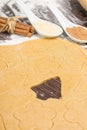 Rolled out ginger bread dough with cutting shapes of christmas decoration Royalty Free Stock Photo