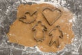 Rolled out gingerbread dough with cookie cutters. Royalty Free Stock Photo