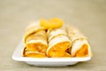 Rolled pancakes on plate Royalty Free Stock Photo