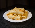 Rolled pancakes on a plate Royalty Free Stock Photo