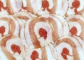 Rolled Pancetta slices. It is an italian salty pork belly, similar to the bacon.
