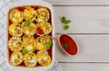 Rolled pasta with ground meat and tomato sause in baking tray Royalty Free Stock Photo