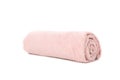 Rolled pink towel isolated on white background