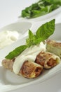 Rolled pore's leaves with cream and basil