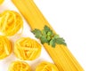 Rolled raw tagliatelle and spaghetti, italian pasta on white background Royalty Free Stock Photo