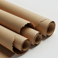 Rolled sheets of brown kraft paper are shown with torn edges. The paper rolls vary in Royalty Free Stock Photo