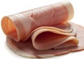 Rolled and sliced ham meat isolated on white background Royalty Free Stock Photo