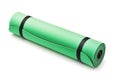 Rolled soft green foam yoga mat Royalty Free Stock Photo