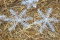 Rolled straw decorated with white snow crystals at rural animal farm as a christmas background Royalty Free Stock Photo