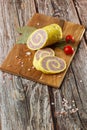 Rolled Stuffed Chicken Breast. Chicken or Turkey Roulade. Low Carb Chicken Roll Ups with cheese on a wooden table with Royalty Free Stock Photo