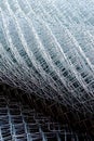 Rolled supplies of shiny new chain link fence Royalty Free Stock Photo