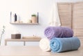 Rolled tidy towels on table in bathroom Royalty Free Stock Photo