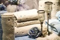 Rolled Towels, Blue Roses and Candle Holders Royalty Free Stock Photo