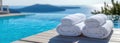Rolled Towels by an Infinity Pool with a View Royalty Free Stock Photo