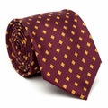 Rolled Burgundy Silk Tie with Yellow Diamond Pattern on White Background necktie men\'s fashion Royalty Free Stock Photo
