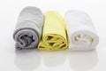 Rolled up microfibre clothes on white background