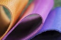 Rolled up multicolored leather samples close up. Commercial and industrial concept Royalty Free Stock Photo