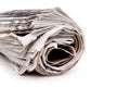 Rolled up newspaper on white Royalty Free Stock Photo